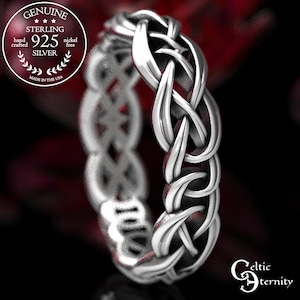 May include: A sterling silver ring featuring an intricate woven knot pattern. The band is marked with text including Genuine Sterling 925 Silver, hand crafted, nickel free, made in the USA, and the brand name Celtic Eternity.