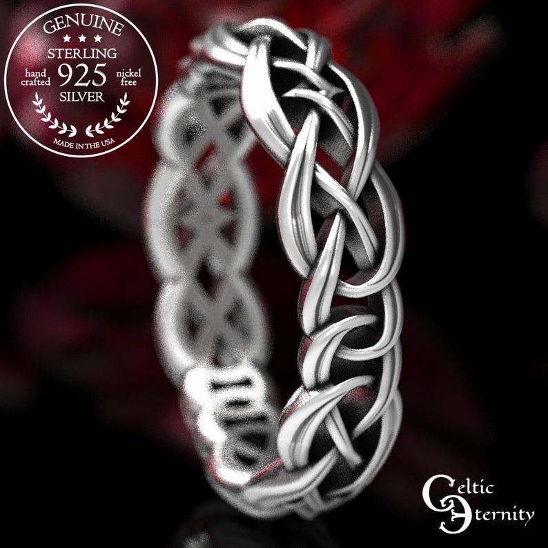 May include: A sterling silver ring featuring an intricate woven knot pattern. The band is marked with text including Genuine Sterling 925 Silver, hand crafted, nickel free, made in the USA, and the brand name Celtic Eternity.