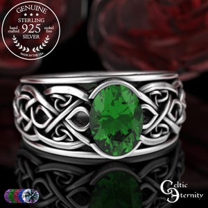 May include: A sterling silver ring with a Celtic knot design and a large oval-cut green gemstone. The ring is marked "925 Silver" and "Made in the USA". The ring is nickel free.
