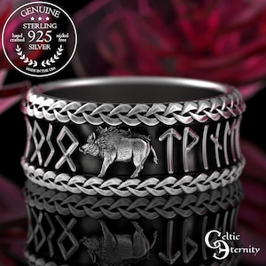 May include: A sterling silver ring with a black band featuring a detailed boar and runic symbols. The ring is hand-crafted and nickel-free, with the text "GENUINE STERLING 925 SILVER" and "MADE IN THE USA" in a circular logo.