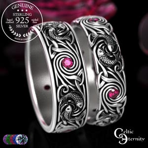 May include: Two sterling silver rings with intricate Celtic knot and fish designs, accented with pink gemstones. The rings are marked "925 Silver" and "Made in the USA". The rings are from "Celtic Eternity".