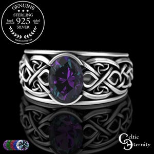 May include: Sterling silver ring with an oval, color-shifting gemstone. The ring features a Celtic knot design around the band and is marked "Genuine Sterling 925 Silver". The ring is nickel free and hand crafted in the USA.