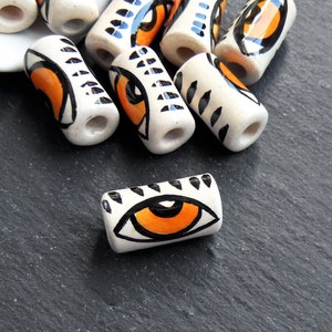 Handmade Evil Eye Ceramic Tube Bead, Long Artisan Bead for Jewelry Making, Handcrafted Pottery Findings, 21x11mm, Orange Eye, 1pc