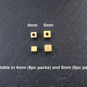 May include: Four small, square, gold-colored beads, 4mm and 5mm in size, are displayed. The image includes the text "Available in 4mm (8pc packs) and 5mm (5pc packs)". These beads are ideal for jewelry making and crafting.