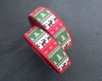 May include: Two spools of red and green Christmas ribbon with a repeating pattern of Christmas trees and reindeer.