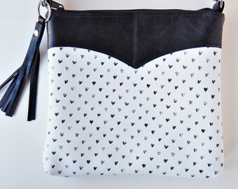 Black and white leather crossbody bag or shoulder bag.  Black hearts on white leather with black trim crossbody bag. Vine and Branch Studio.