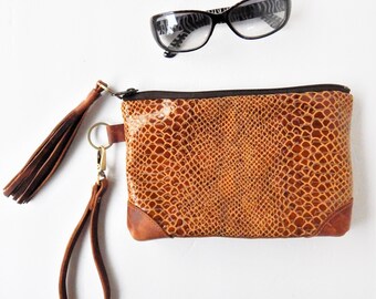 Snakeskin print leather wristlet or clutch.  Vine and Branch Studio.