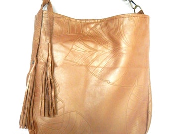 Golden tan leather shoulder or crossbody purse.  Tropical embossed leather bucket bag. Vine and Branch Studio.