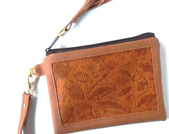 Tan tropical embossed leather wristlet or clutch.     Vine and Branch Studio.