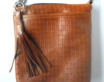 Brown leather crossbody bag.