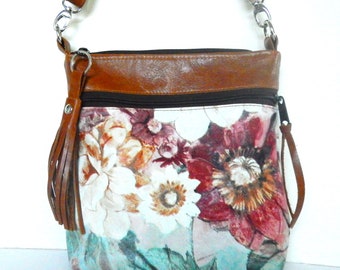 Floral leather crossbody bag.  Crossbody or shoulder bag in flowered leather with smooth leather trim.  Vine and Branch Studio.