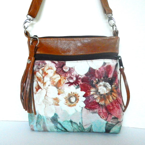 Floral leather crossbody bag.  Crossbody or shoulder bag in flowered leather with smooth leather trim.  Vine and Branch Studio.