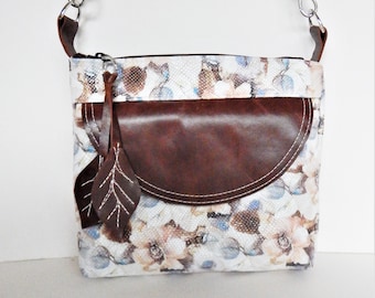 Floral leather crossbody bag.   Flowered white leather crossbody or shoulder bag.