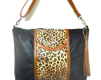 Black and cheetah leather crossbody bag with pockets.  Leather crossbody or shoulder bag in black with cheetah trim. Vine and Branch Studio.