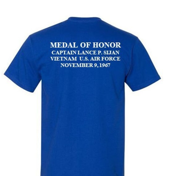 MEDAL OF HONOR* Captain Lance P. Sijan*Vietnam*November 9,1967* 2-Sided Blue Shirt.Vinyl (Air Force Officially Licensed)