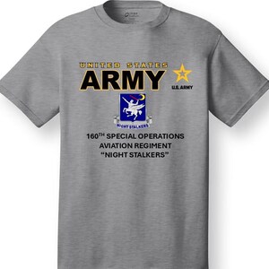 May include: A gray t-shirt with the text "UNITED STATES ARMY" and a yellow star. The shirt also features a patch with the text "NIGHT STALKERS" and a graphic of a winged horse. The text "160TH SPECIAL OPERATIONS AVIATION REGIMENT "NIGHT STALKERS" is printed below the patch.