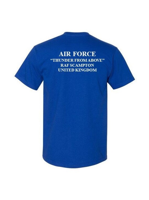 RAF SCAMPTON* United Kingdom*  2-Sided Blue Shirt. USAF logo on front-Vinyl print on back. (Officially Licensed)