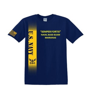 May include: A navy blue t-shirt with a yellow stripe down the side. The stripe features the words "U.S. NAVY" and a stylized eagle and anchor. The text "SEMPER FORTIS" is printed on the shirt, along with "NAVAL BASE GUAM MARIANAS".