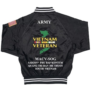 May include: Black satin bomber jacket with white and black striped trim. The back of the jacket features a green outline of Vietnam with the text "ARMY", "VIETNAM VETERAN", "MACV-SOG", "SAIGON* PHU BAI*KONTUM", "QUANG TRI-BAN ME THUOT", and "SOUTH VIETNAM".