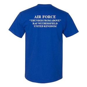 May include: Royal blue t-shirt with white text that reads "AIR FORCE" "THUNDER FROM ABOVE" "RAF WETHERSFIELD" "UNITED KINGDOM"