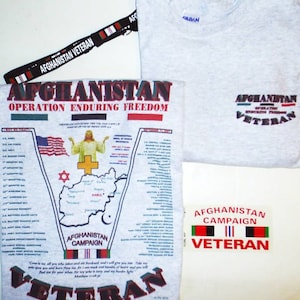 May include: A gray t-shirt with the text "Afghanistan Operation Enduring Freedom" and a map of Afghanistan. The shirt also has a small patch with the text "Afghanistan Veteran".