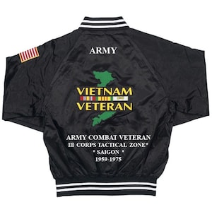May include: Black satin bomber jacket with a white embroidered 'ARMY' on the back. The jacket features a green embroidered map of Vietnam with the text 'VIETNAM VETERAN' and a row of colorful ribbons. The text 'ARMY COMBAT VETERAN III CORPS TACTICAL ZONE* *SAIGON* 1959-1975' is also embroidered on the back.