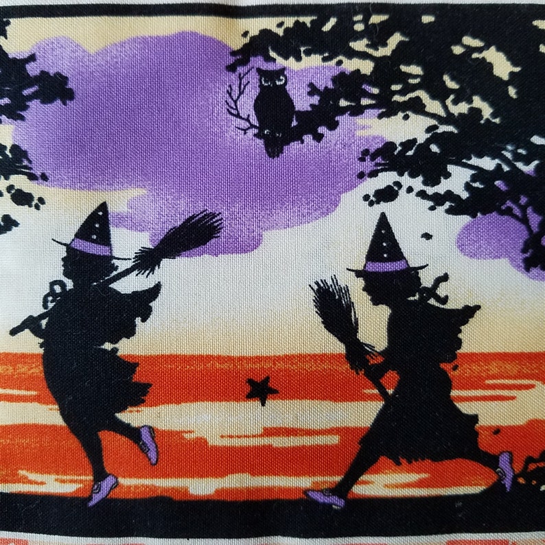 May include: Two black silhouettes of witches with purple hats and brooms flying over a sunset with a black silhouette of an owl perched on a branch.