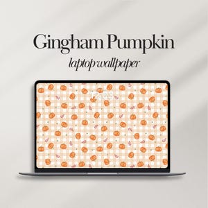May include: A laptop screen displaying a digital wallpaper with a repeating pattern of orange pumpkins and small green hearts over a light beige gingham background. The text Gingham Pumpkin laptop wallpaper is printed above the laptop screen.