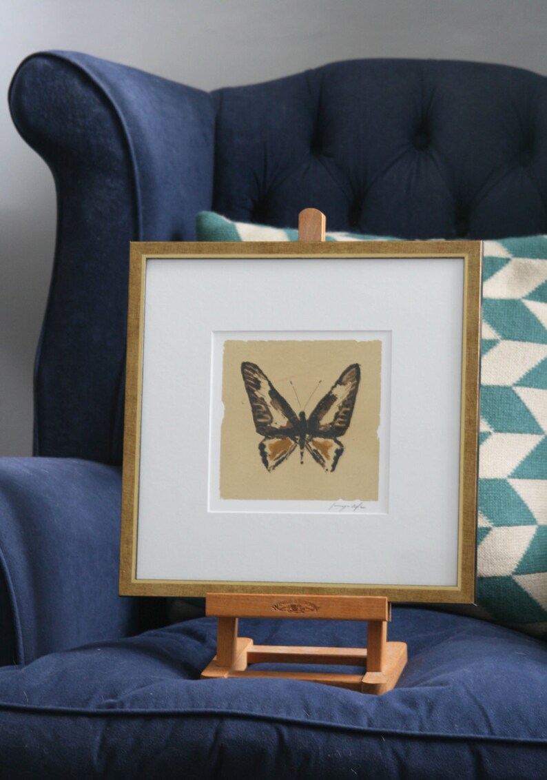 Hand painted butterfly in pen and ink silhouette on gold leaf on paper. image 1