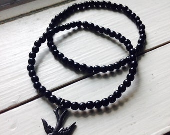 Black Beaded Bracelets with Bird Charm