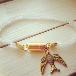 Matte Transparent Bead Loom Bracelet with Gold Bird Charm