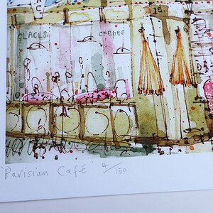 May include: A watercolor painting of a Parisian cafe scene with the text 'Parisian Cafe' and '4/150' in the bottom right corner. The painting features a cafe with tables, chairs, and umbrellas. The cafe is painted in a light and airy style, with a focus on the details of the cafe's interior.