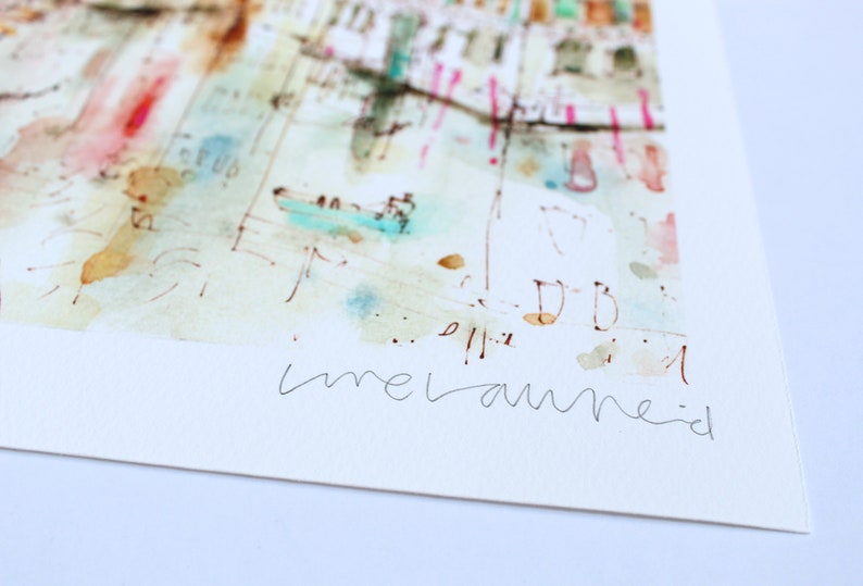 May include: A watercolour painting of a cityscape with a signature by the artist, "melanie".