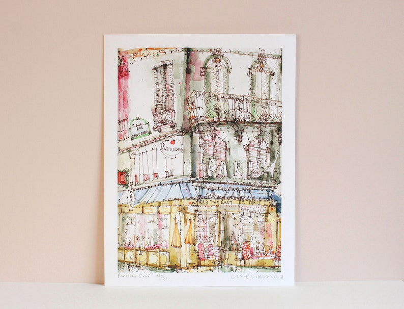 May include: A watercolor painting of a Parisian cafe with a blue awning and the word "PARIS" written in large letters on the building. The cafe is located on a street corner and has a sign that says "Patisserie Cafe".