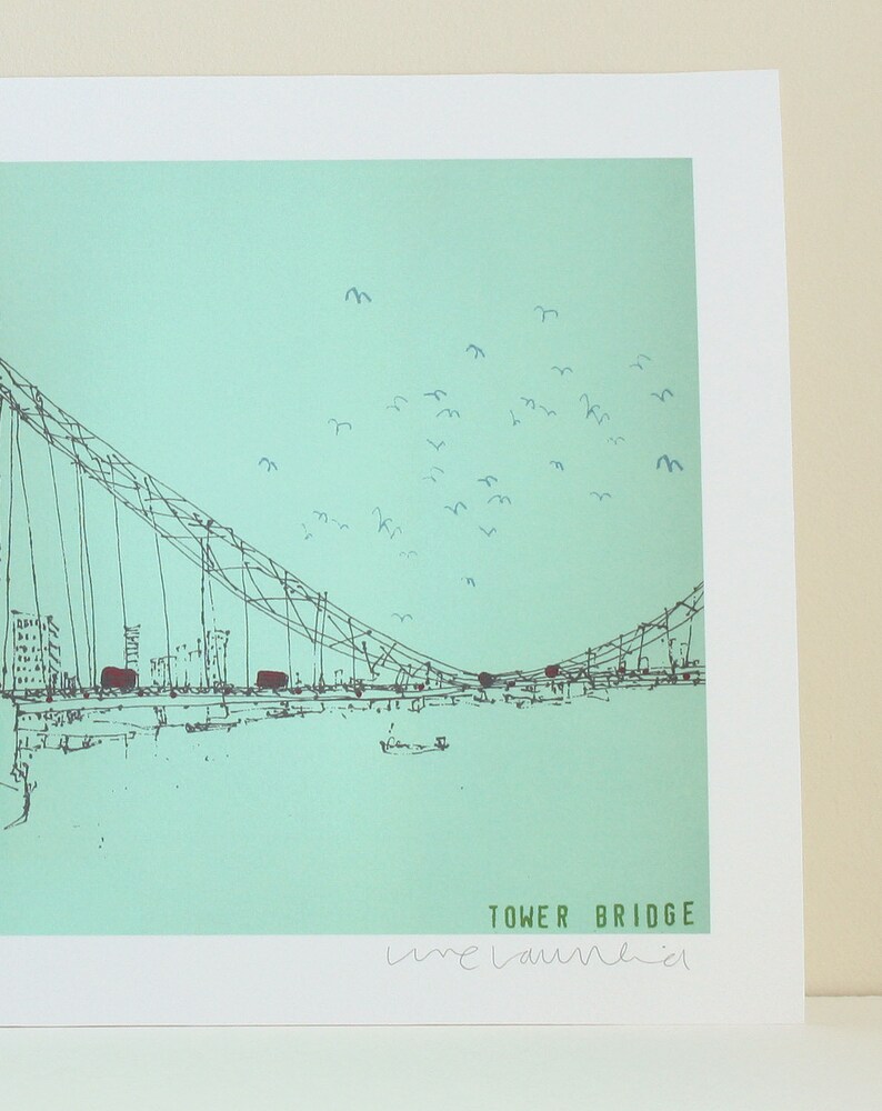 May include: A black and white line drawing of the Tower Bridge in London, England. The bridge is set against a light blue sky with a flock of birds flying overhead. The text "TOWER BRIDGE" and the artist's signature "lime laumkiel" are visible at the bottom of the image.