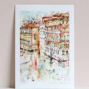 May include: Watercolour painting of buildings in Venice, Italy. The buildings are painted in shades of brown, yellow, and pink. The water is a light blue colour. The painting is signed "Venice" and "melanie d"