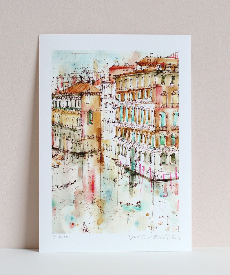 May include: Watercolour painting of buildings in Venice, Italy. The buildings are painted in shades of brown, yellow, and pink. The water is a light blue colour. The painting is signed "Venice" and "melanie d"