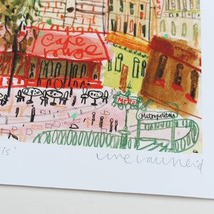 May include: A watercolor painting of a Parisian street scene with a cafe called "Cafe Rouge" and a Metro station. The painting is signed "une bauneid" in the bottom right corner.
