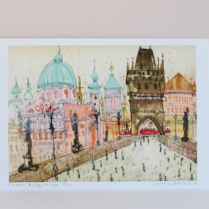 May include: A watercolor painting of Charles Bridge in Prague, Czech Republic. The painting features a view of the bridge with its iconic towers and the surrounding buildings. The painting is done in a loose, impressionistic style with a focus on capturing the atmosphere of the city.