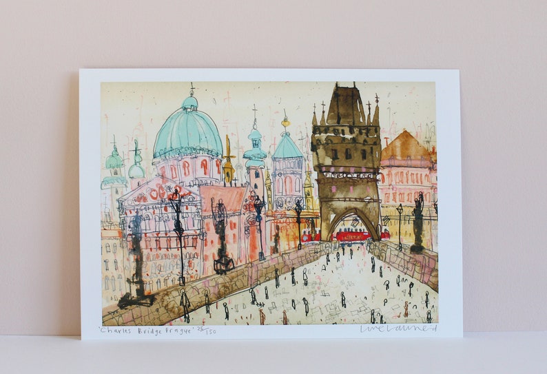 May include: A watercolor painting of Charles Bridge in Prague, Czech Republic. The painting features a view of the bridge with its iconic towers and the surrounding buildings. The painting is done in a loose, impressionistic style with a focus on capturing the atmosphere of the city.