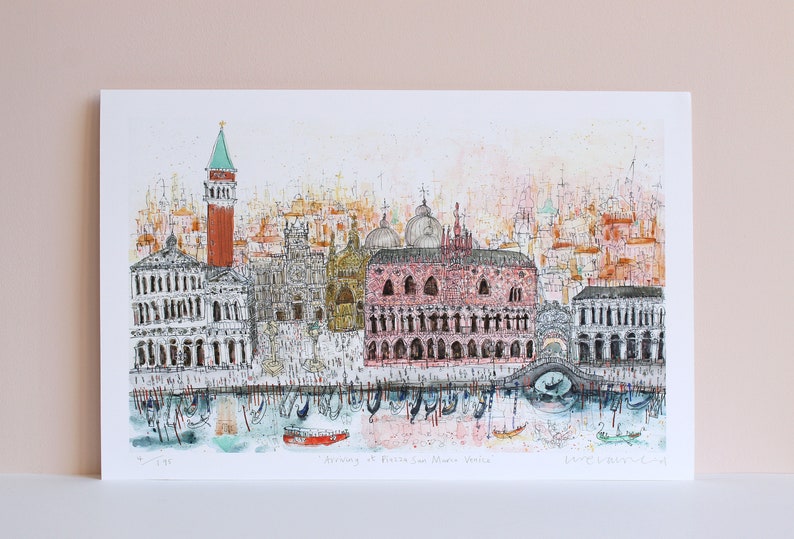 May include: A watercolor illustration of the Doge's Palace in Venice, Italy. The palace is a large, pink building with many windows and arches. There are gondolas in the water in front of the palace. The text "Arriving at Piazza San Marco Venice" is printed below the image.