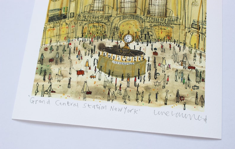 May include: A watercolor illustration of Grand Central Station in New York City. The illustration features a busy scene with many people walking around the station. The station's iconic clock is visible in the background. The artist's signature, "Luke Laurie", is written in the bottom right corner.