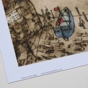 May include: A black and white ink drawing of a seascape with boats and the text "Robin Hoods Bay" and "www.clarecaulfield.co.uk".