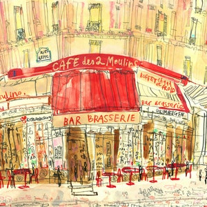May include: Watercolor illustration of a Parisian cafe, "Cafe des 2 Moulins," with a red awning and the words "Bar Brasserie." The artwork depicts a street scene with people and tables, capturing the essence of a European cafe.