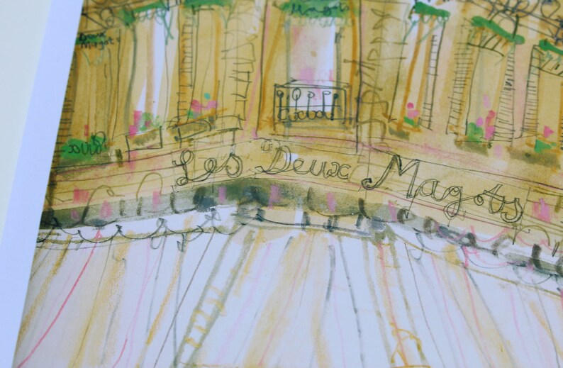 May include: Watercolor painting of a building facade with the text "Les Deux Magots" in cursive. The artwork features a palette of beige, pink, and green, with architectural details like balconies and awnings. The style is reminiscent of a sketch.