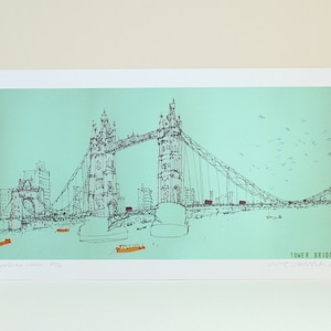 May include: A black and white line drawing of Tower Bridge in London, England. The bridge is depicted against a light blue background with a flock of birds flying overhead. The text "Tower Bridge" is written in the bottom right corner of the image.