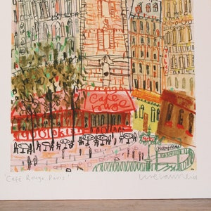 May include: A watercolor painting of a Parisian street scene with a cafe called "Cafe Rouge" in the center. The cafe has red awnings and tables with chairs outside. The buildings are painted in a variety of colors, including yellow, orange, and brown. The painting is signed "Une Larme" in the bottom right corner.
