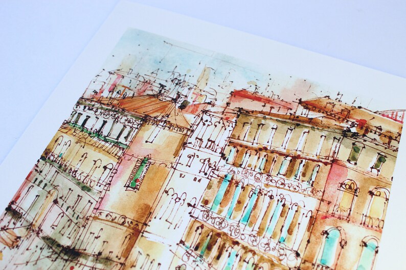 May include: Watercolour painting of a cityscape with buildings in shades of brown, red, and blue. The buildings have many windows and balconies. The painting has a light, airy feel.