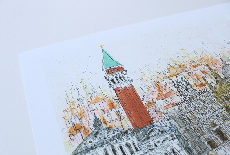 May include: A watercolor painting of a cityscape with a tall, red tower with a green roof. The tower is surrounded by smaller buildings and spires, all rendered in a loose, sketchy style. The background is a light blue, suggesting a clear sky.
