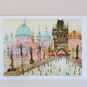 May include: A watercolor painting of Charles Bridge in Prague, Czech Republic. The painting features a view of the bridge with its iconic towers and the surrounding buildings. The painting is done in a loose, impressionistic style with a focus on capturing the atmosphere of the city.